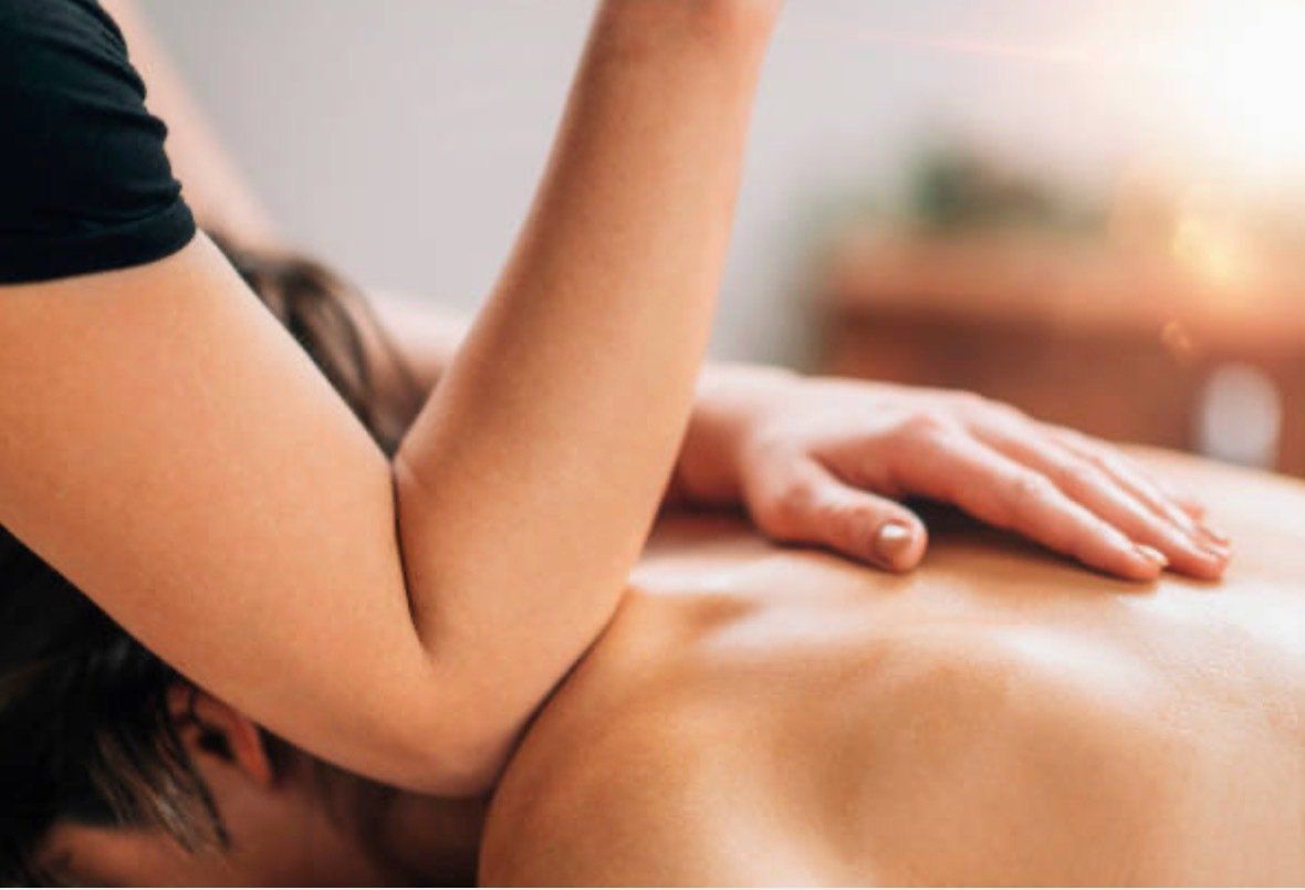 A woman is getting a massage on her back.