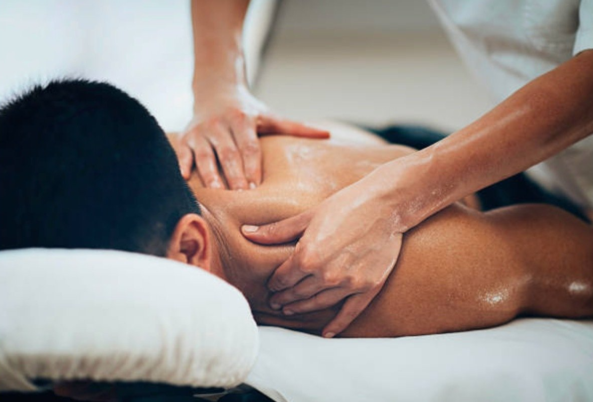 A man is getting a massage at a spa.