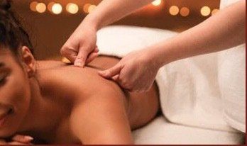 A woman is getting a massage at a spa.