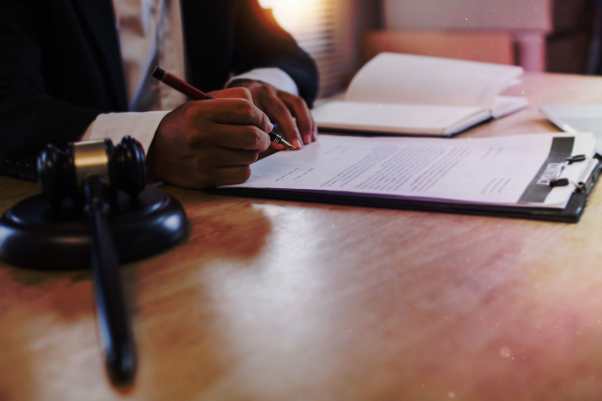 A man is signing a contract.