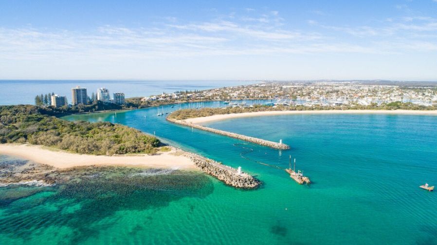 An Aerial View Of A Body Of Water With A City In The Background — Cool & Secure In Maroochydore, QLD