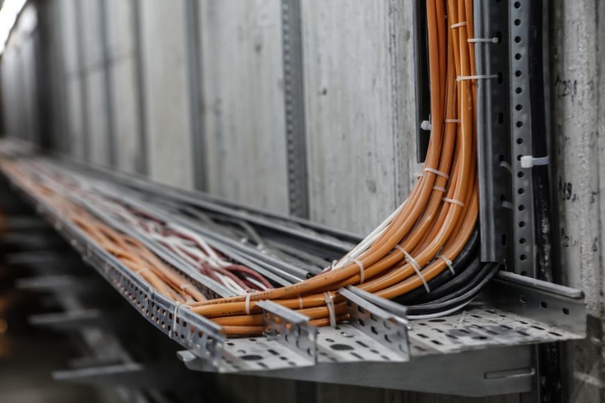 A Bunch Of Wires Are Connected To A Wall — Cool & Secure In Noosa, QLD