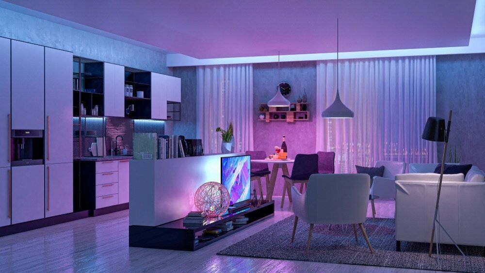 A Living Room And Kitchen With Purple Lights On The Ceiling — Cool & Secure In Noosa, QLD
