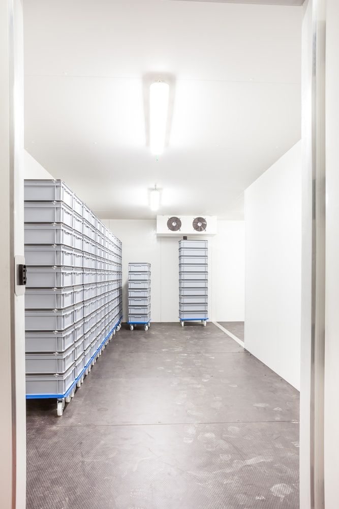 A Room With A Lot Of Boxes On The Floor And A Door — Cool & Secure In Maroochydore, QLD
