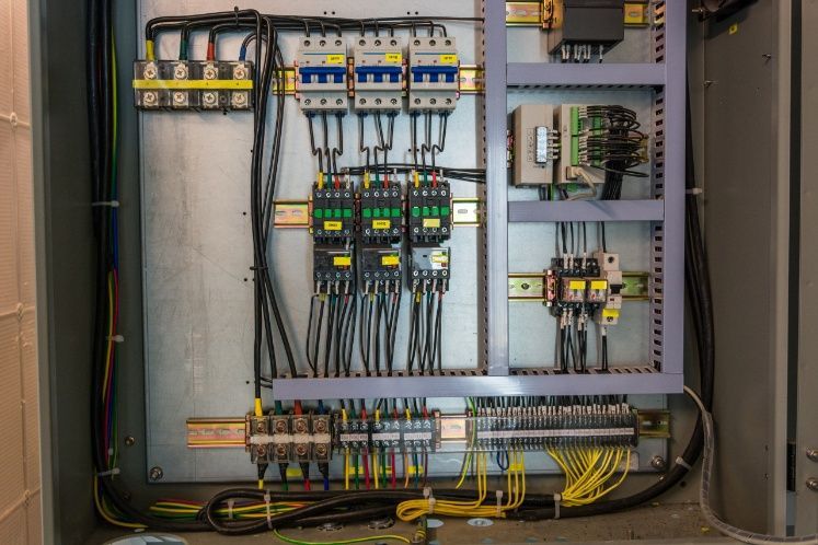 A Close Up Of An Electrical Panel With A Lot Of Wires Coming Out Of It — Cool & Secure In Buderim, QLD