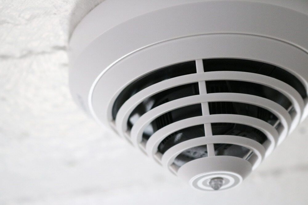 A Close Up Of A Smoke Detector On The Ceiling — Cool & Secure In Buderim, QLD