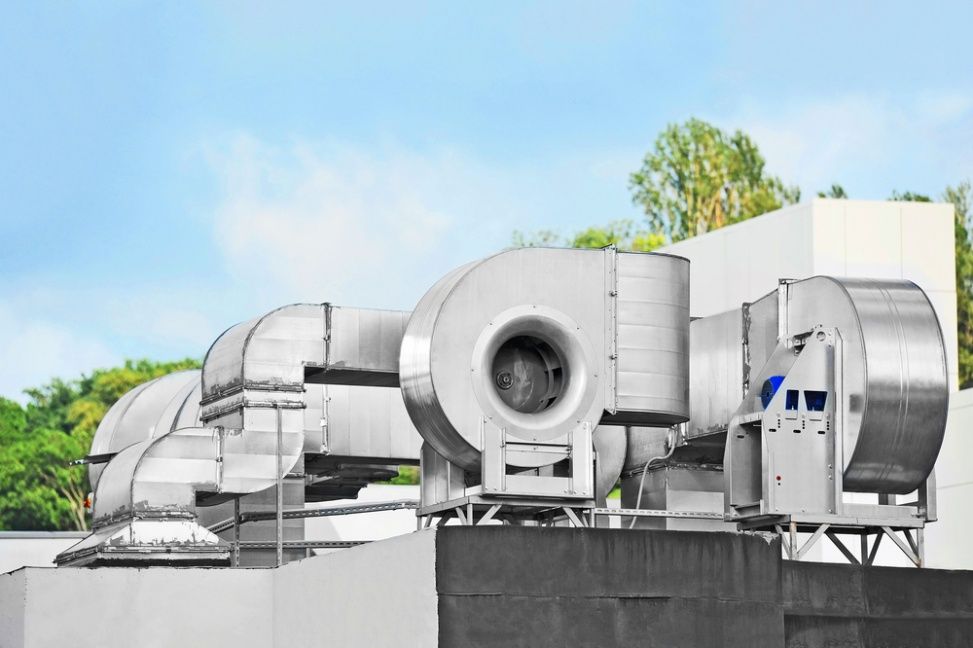 There Are A Lot Of Fans On The Roof Of A Building — Cool & Secure In Maroochydore, QLD
