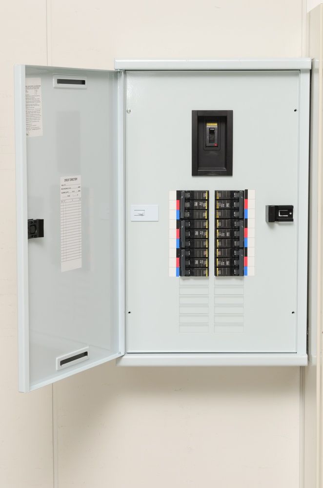 A White Electrical Box Is Hanging On A Wall With The Door Open — Cool & Secure In Buderim, QLD