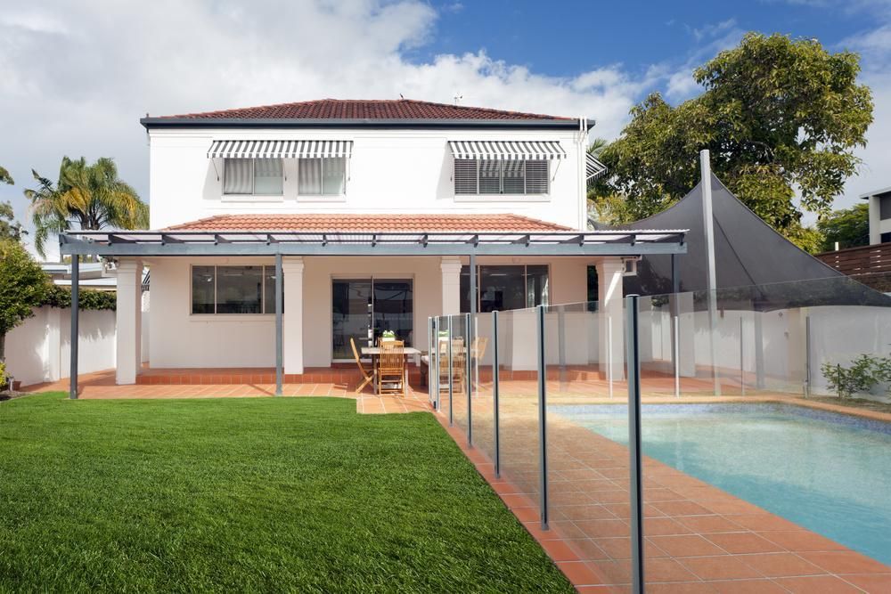 A White House With a Swimming Pool in the Backyard — Lennox Build In Ocean Shores, NSW