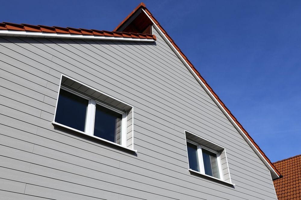 Gray house exterior with red roof — Lennox Build In Lennox Head, NSW