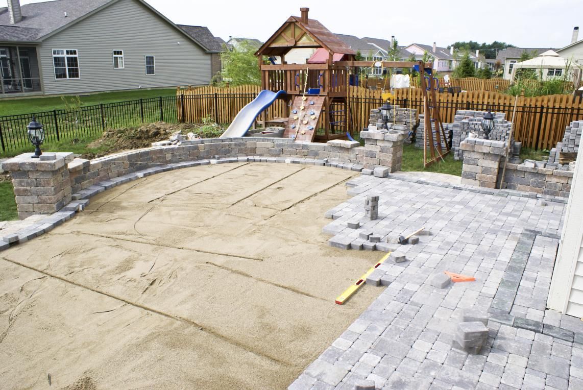 A Patio is Being Built in a Backyard With a Playground in the Background — Lennox Build In Brunswick Head, NSW