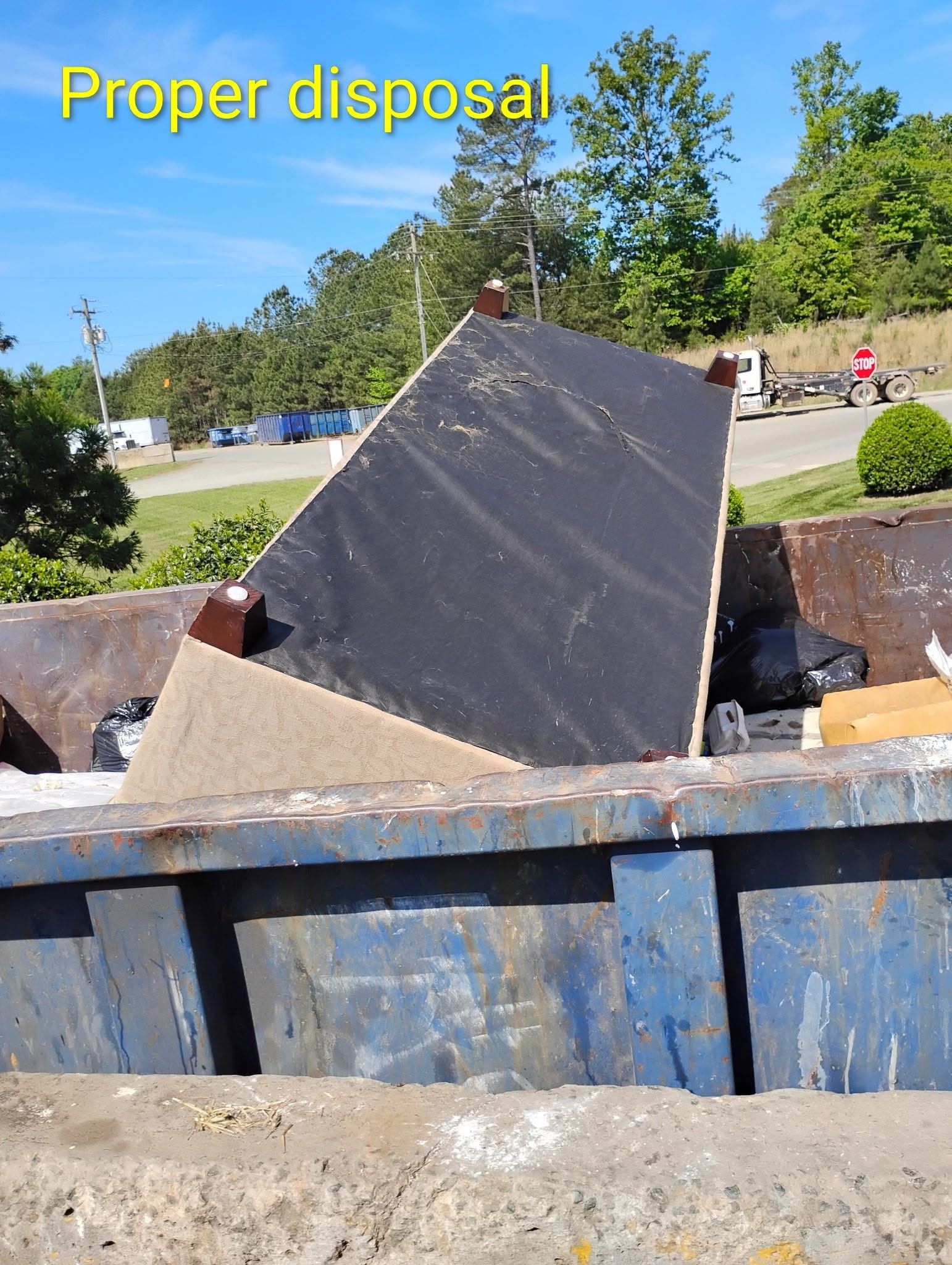 Dumpster filled with construction debris, including a large dark panel, under “Proper disposal” text.