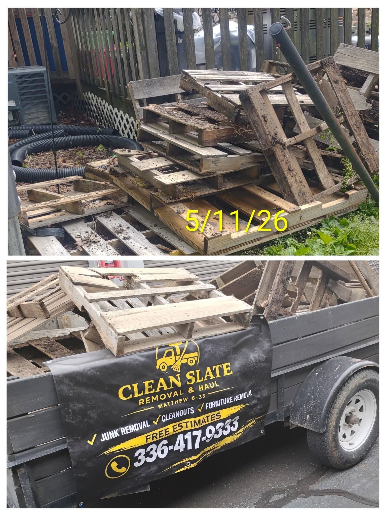 Trailer piled with broken wooden pallets and debris in a yard, with Clean Slate logo on the side.