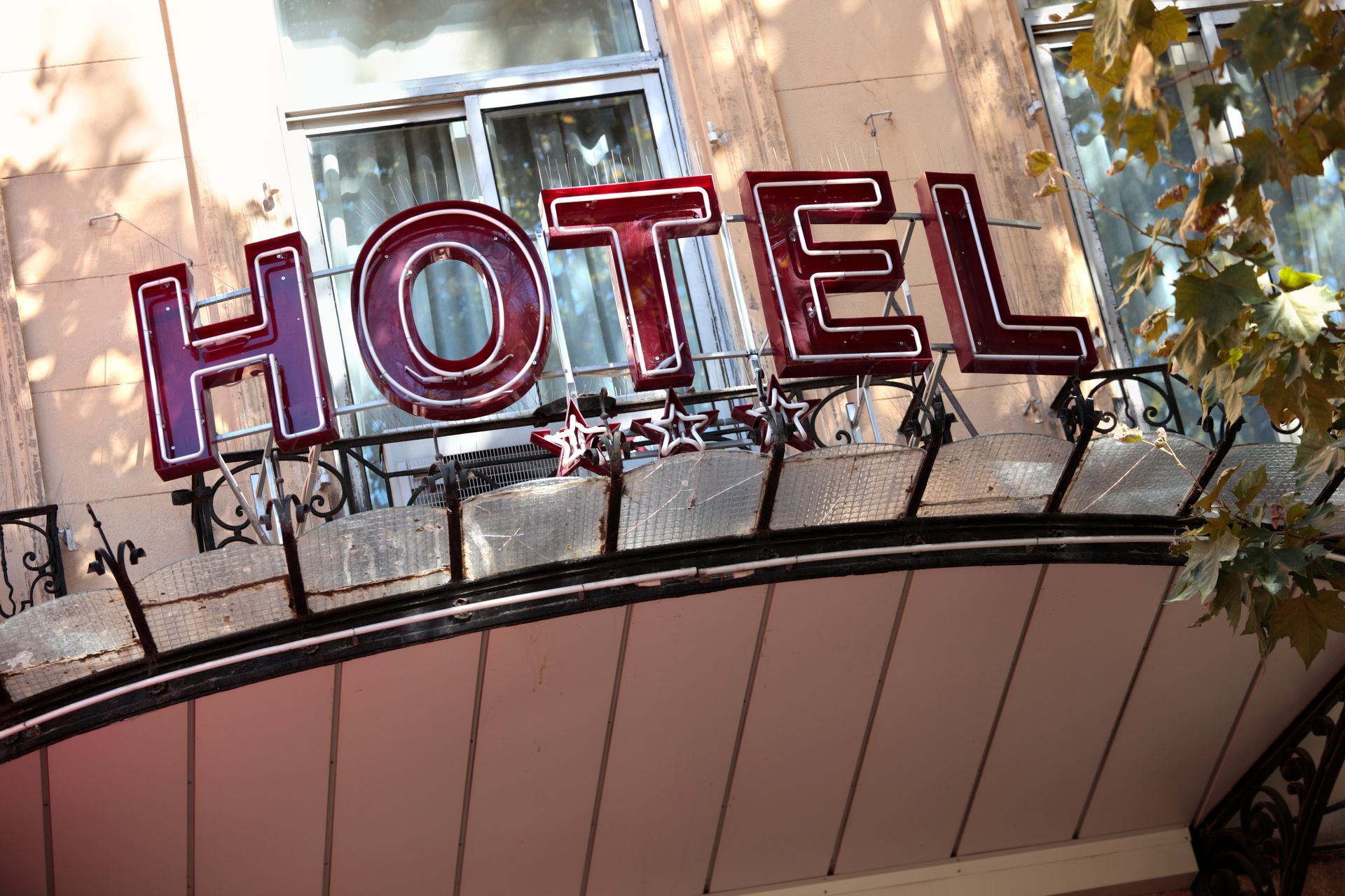 The word hotel is on the front of a building