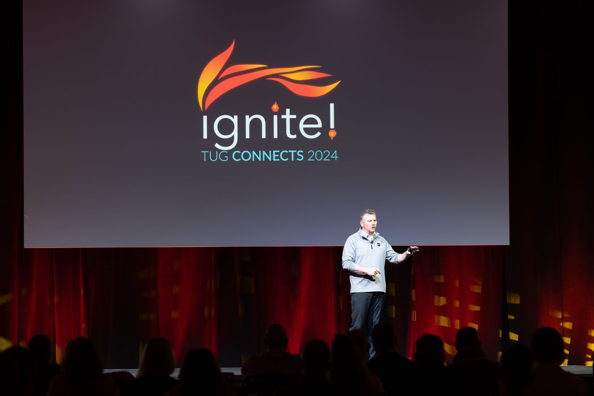 Man speaking on stage at 