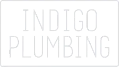 Logo reading “INDIGO PLUMBING” in light gray on a white background
