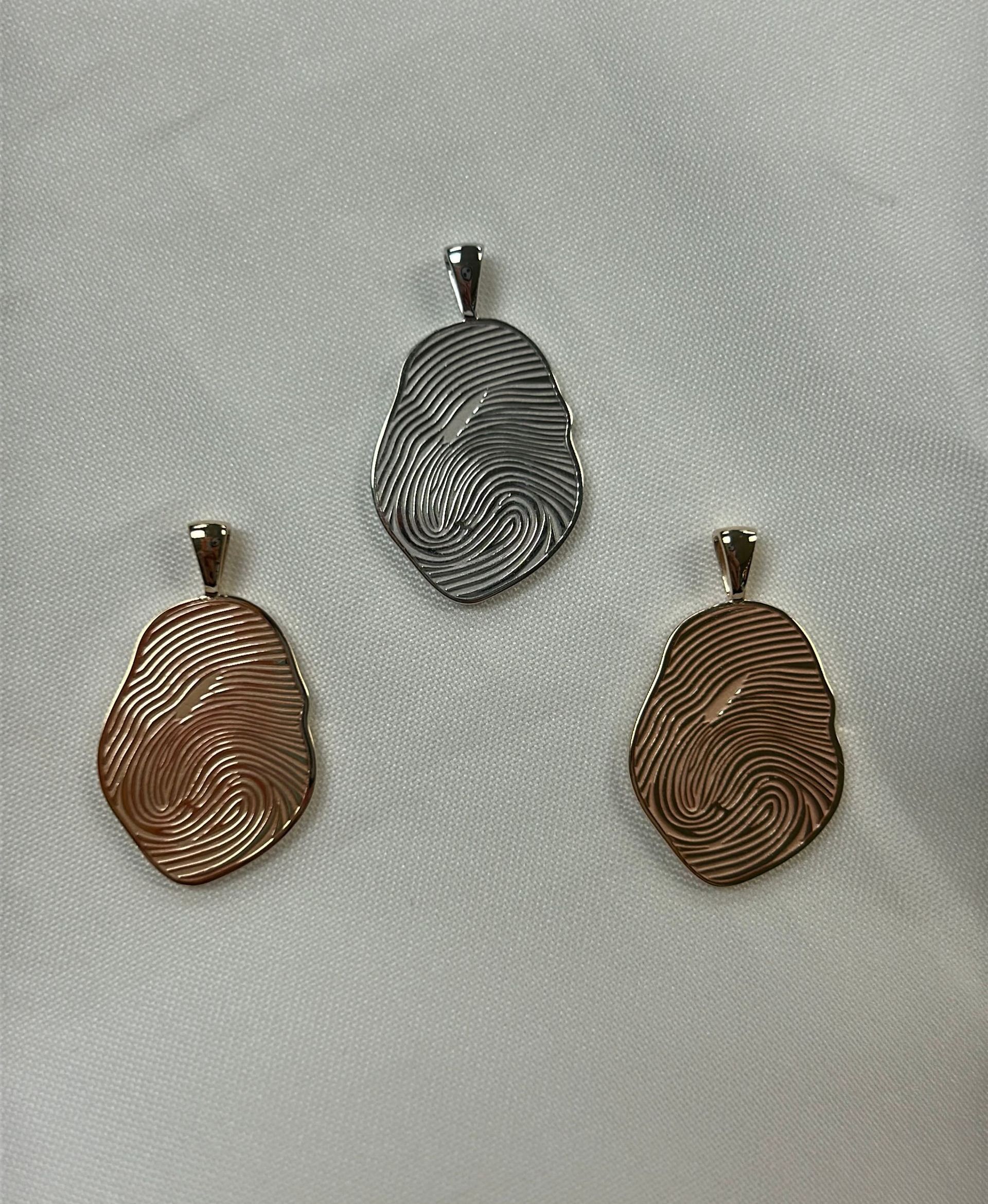 Custom made finger print charms.