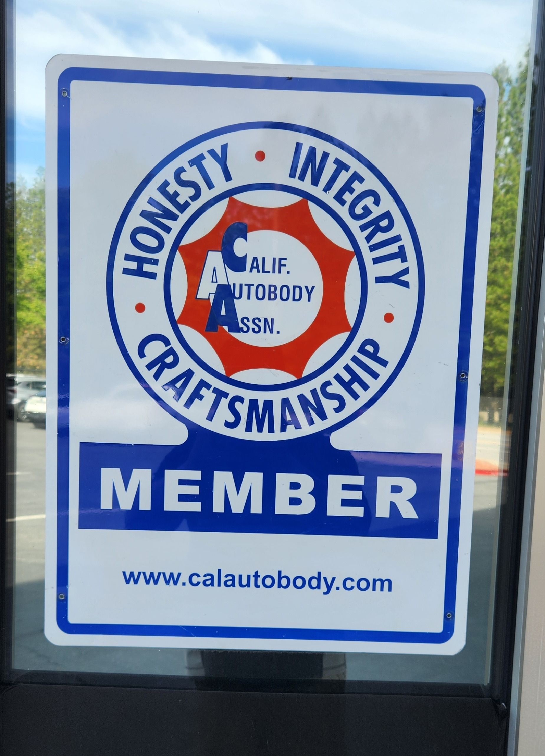 Caliber Auto Body sign with “Honesty, Integrity, Craftsmanship” and “Member” text | Tripp's Auto Body