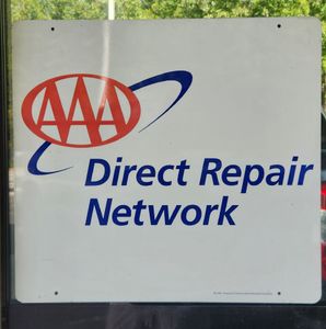 AAA Direct Repair Network sign on a white board with blue and red logo | Tripp's Auto Body