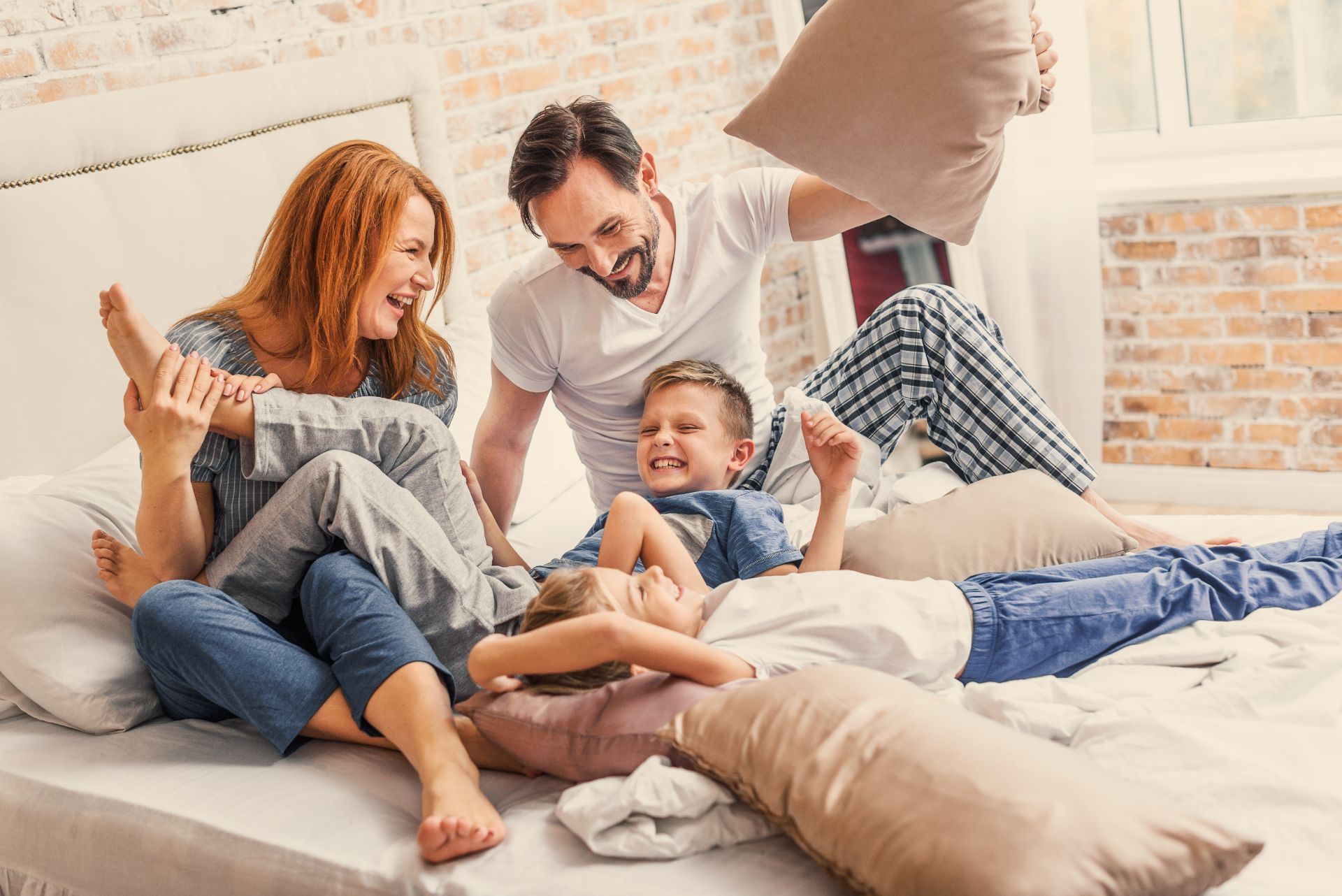 Family of 4 laying down