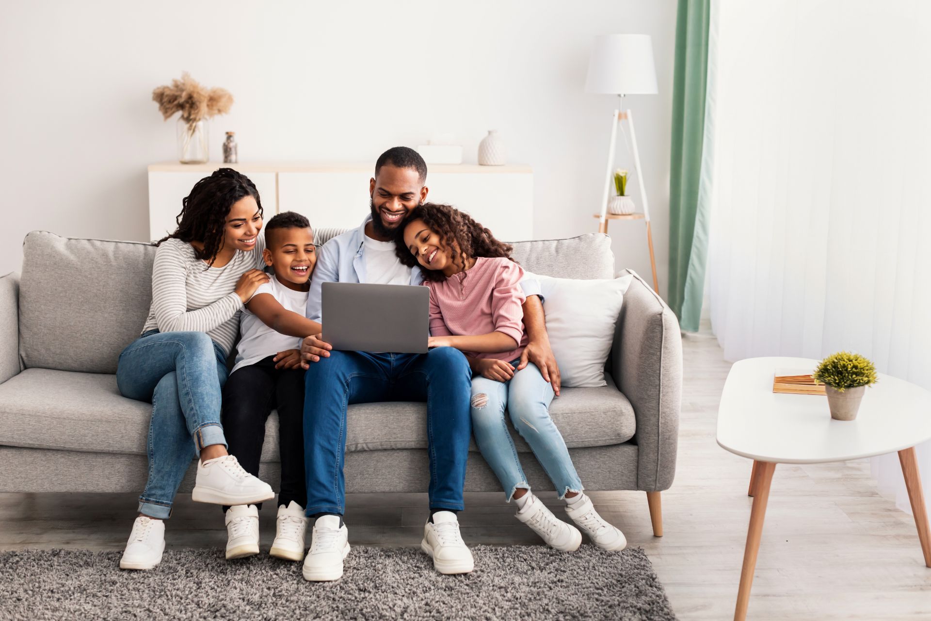 Family looking at a laptop