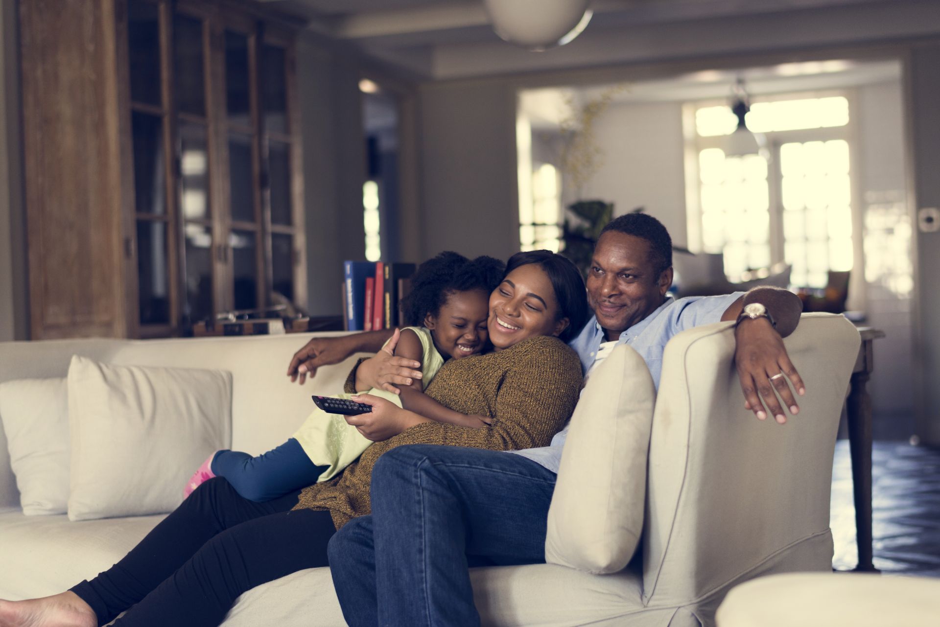 Family of 3 watching TV