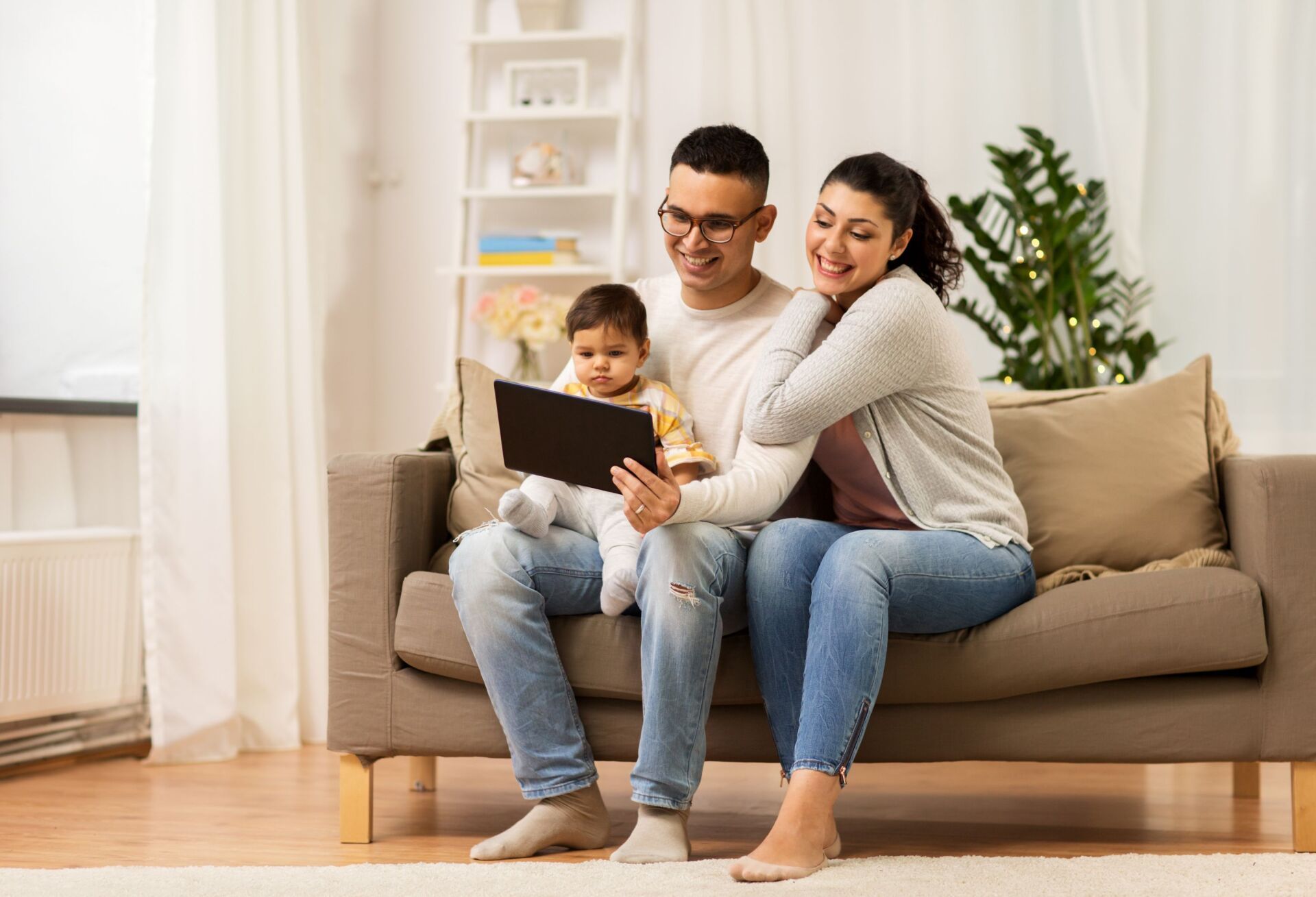 Another family of 4 sitting on a couch