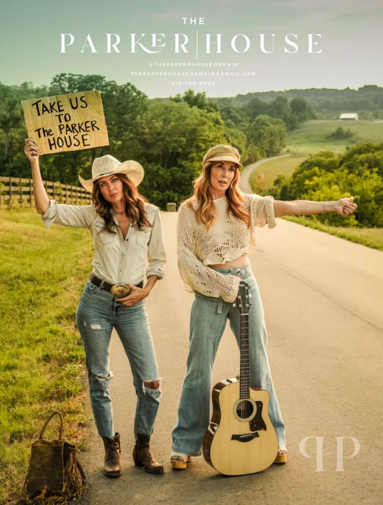 Two women hitchhiking on a road, holding a sign for 