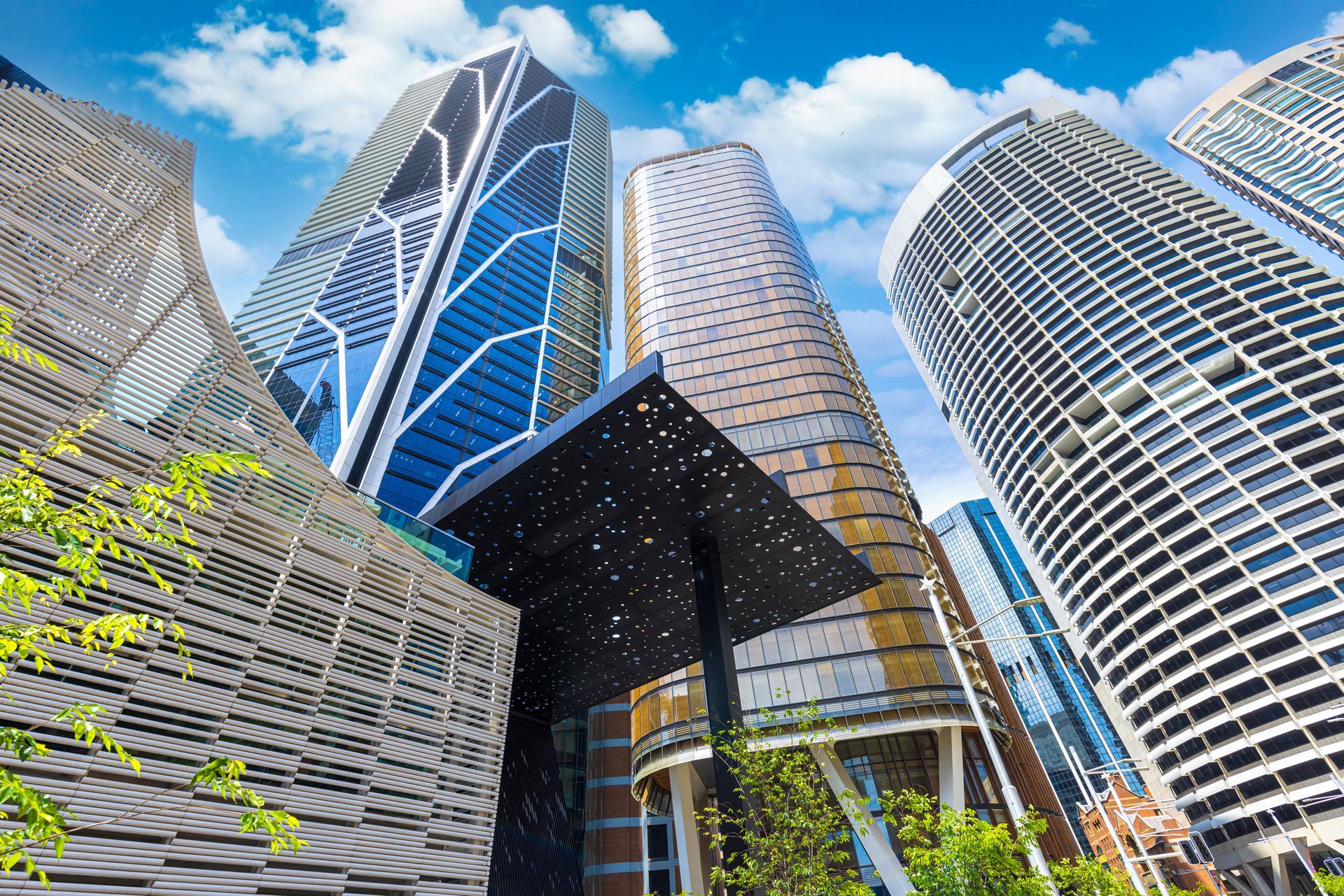 Skyscrapers against a blue sky; modern architecture in an urban setting.