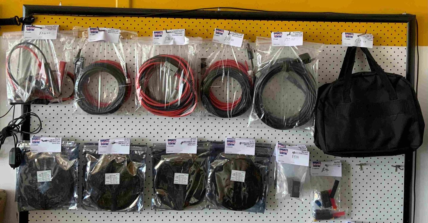 A Bunch Of Wires Are Hanging On A Wall Next To A Bag — Burnett Home Energy Centre In Bundaberg Central, QLD