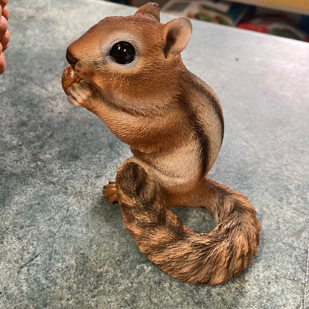 A Small Chipmunk Figurine is Sitting on a Table — Wingham Nursery and Florist PTY Ltd In Wingham, NSW