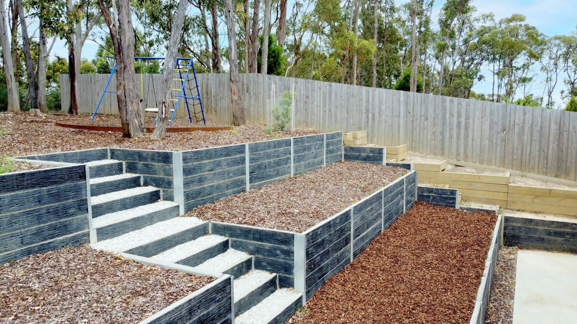 Stepped retaining walls installed by Kanga Dig It Landscaping Ballarat