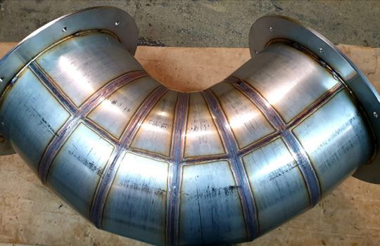 A close up of a metal pipe on a table