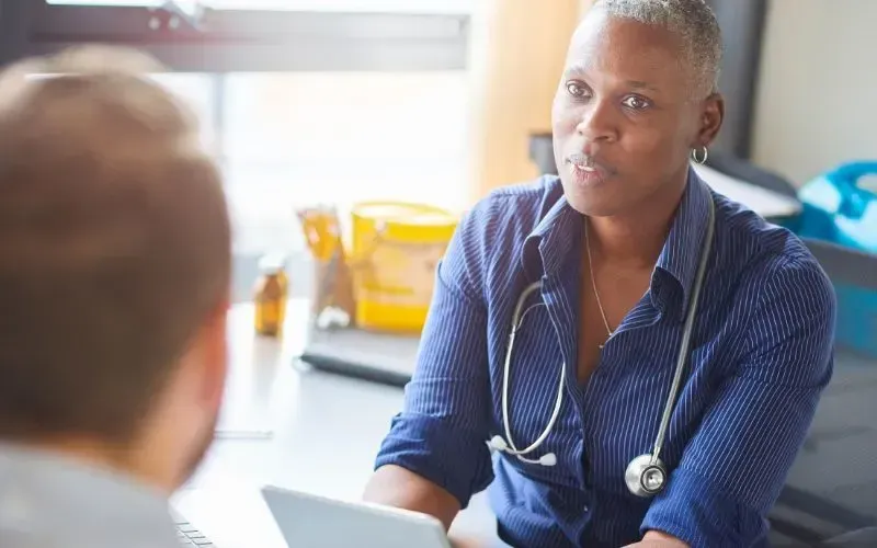 Female GP serving Belconnen patients with comprehensive healthcare, preventive care, and medical con