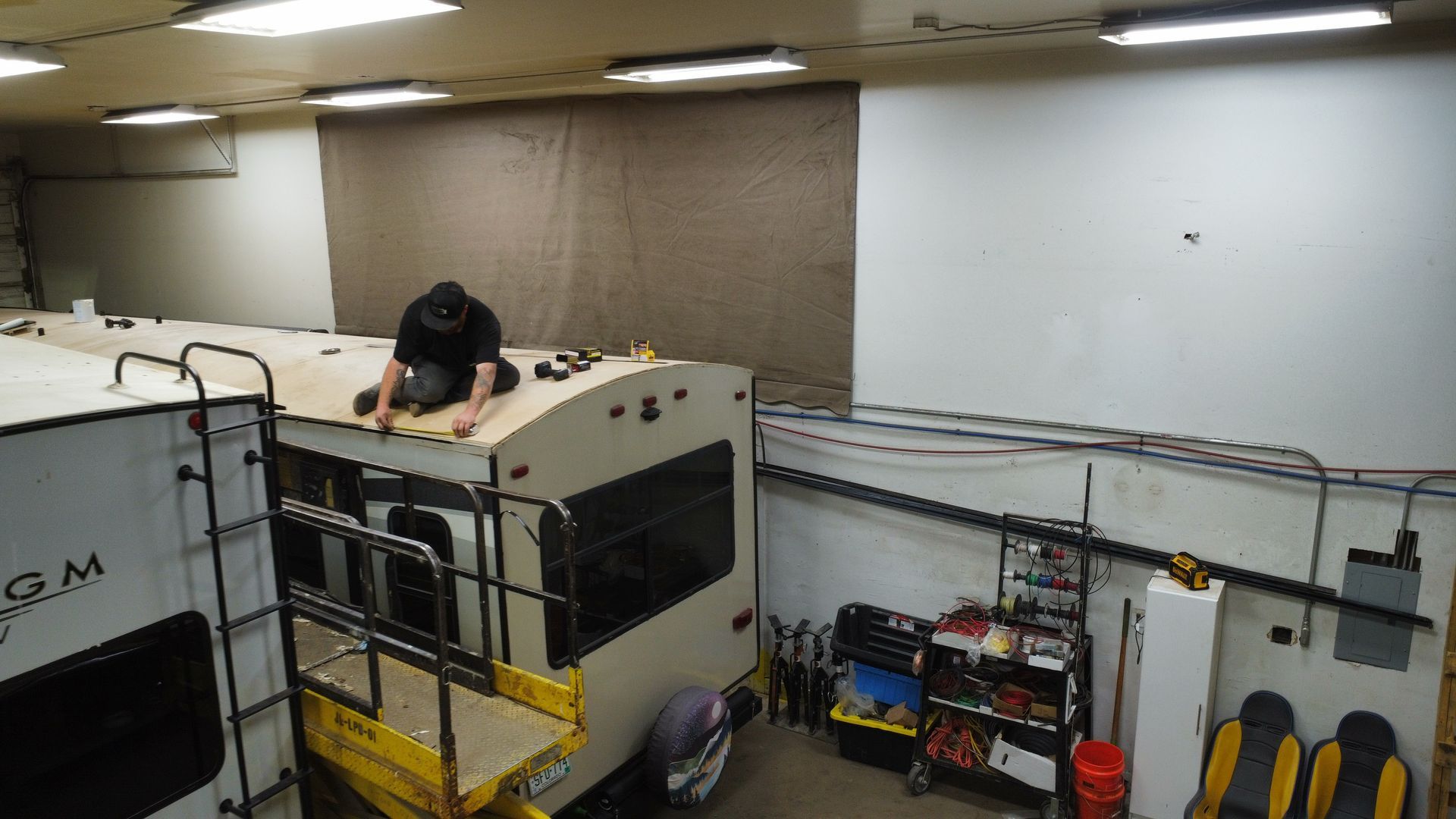 Jefe's RV Service tech repairing roof