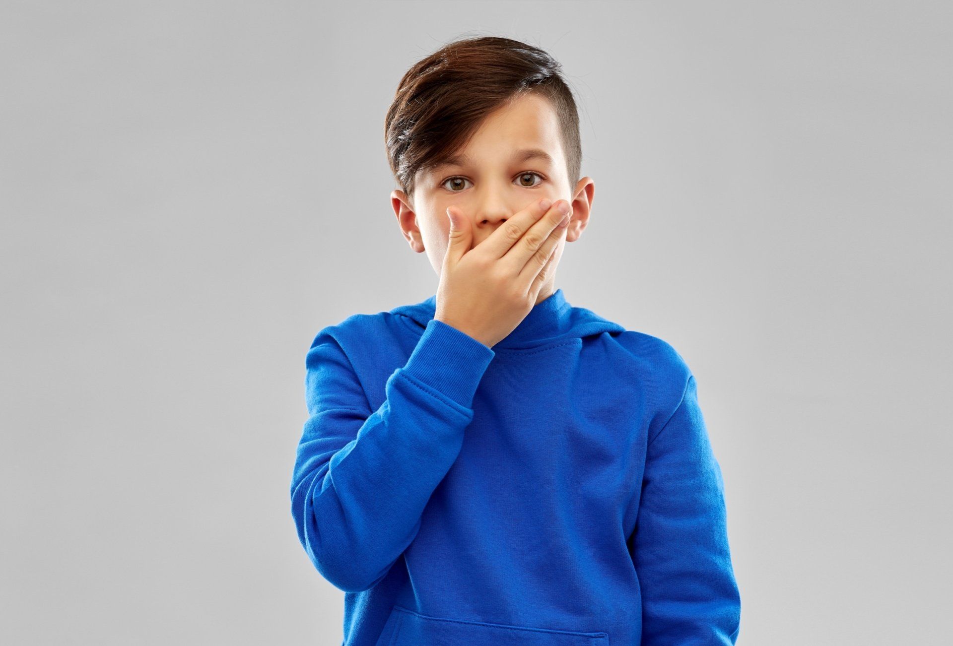 Child holding mouth
