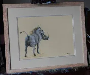 Framed drawing of a gray rhinoceros on a cream background