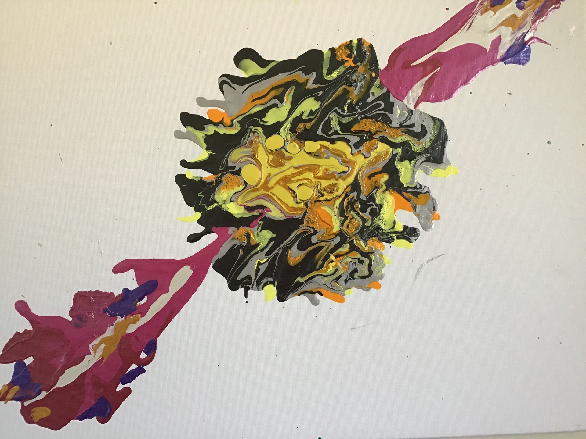 Abstract black, yellow, and purple paint splash on a light background