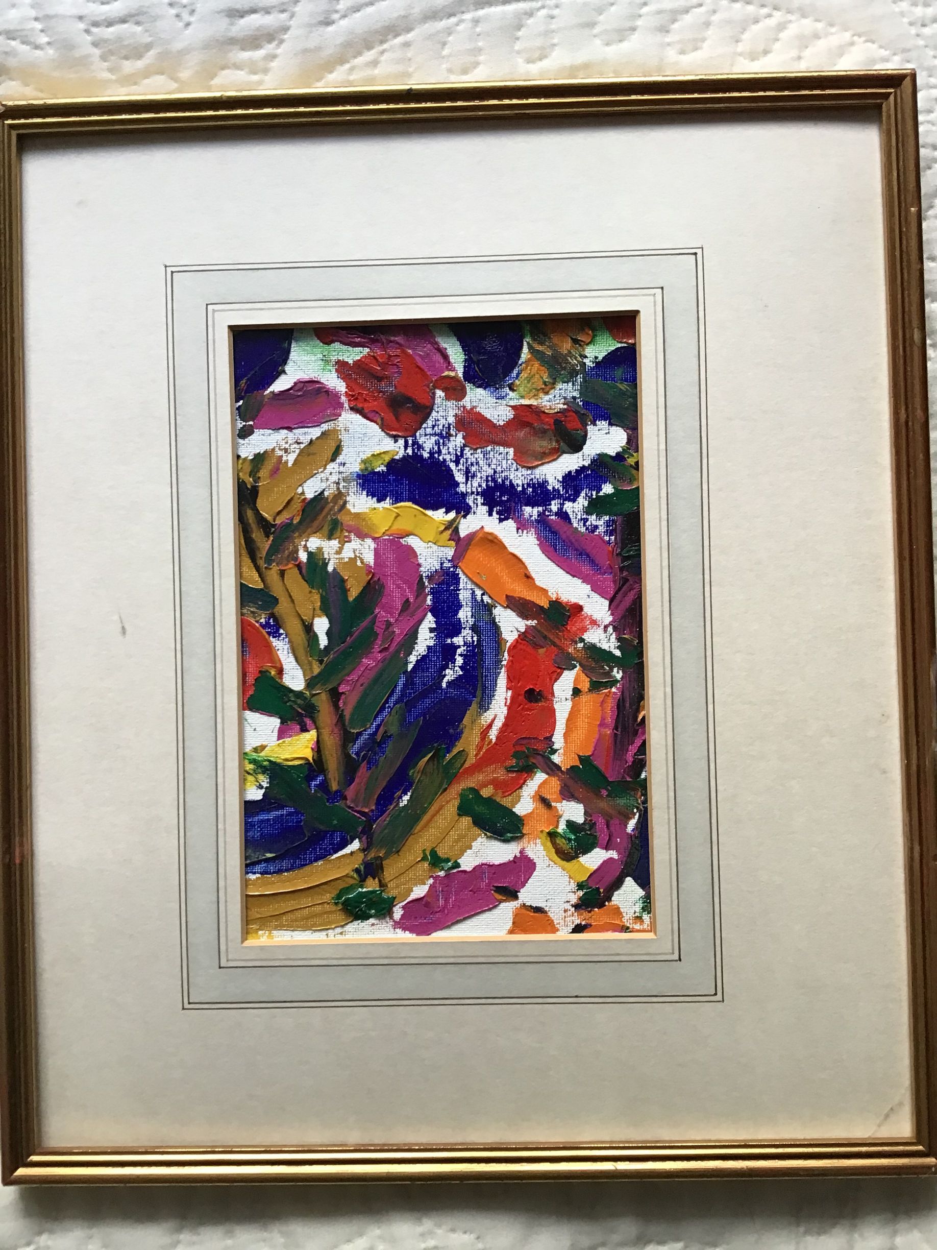 Framed abstract painting with colorful brushstrokes in red, blue, green, gold, and white