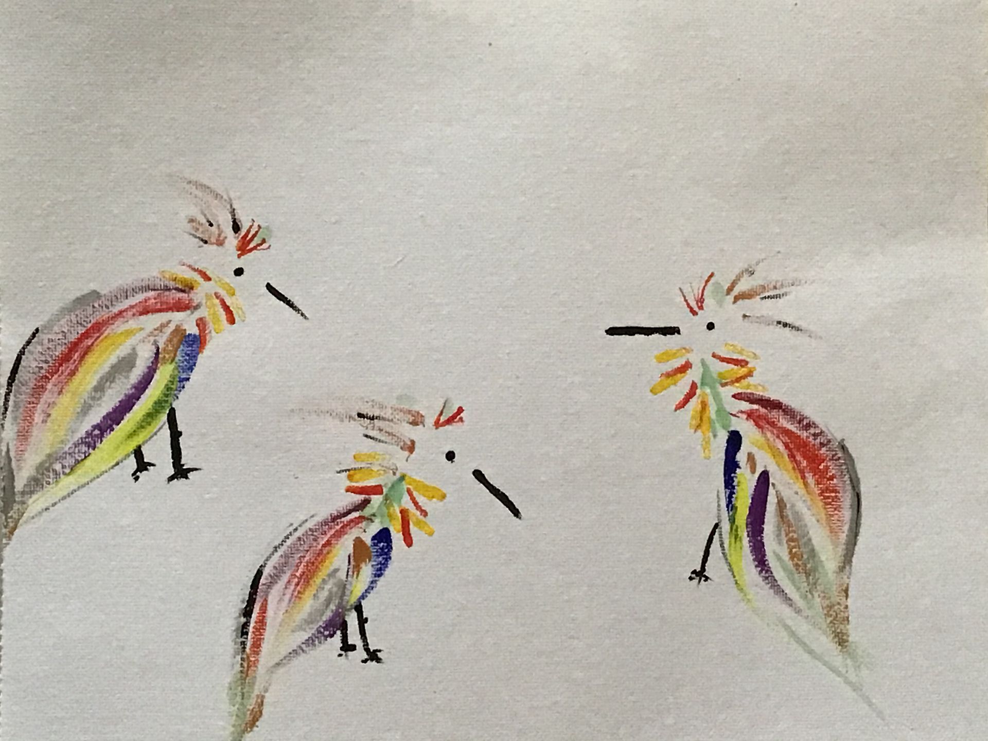 Three colorful bird-like figures with long beaks on a light background