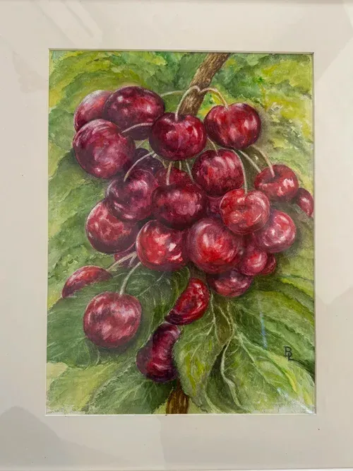 Cluster of red cherries with green leaves in a painted still life against a light background