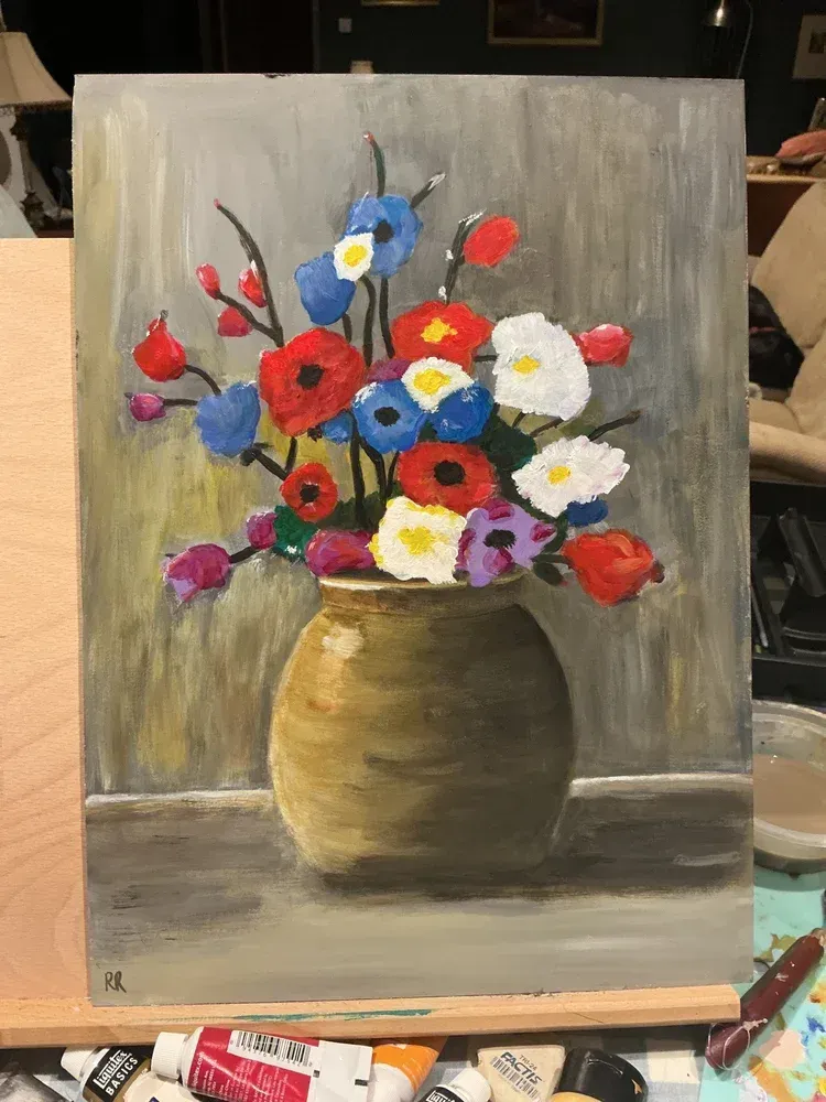 Painted vase of colorful flowers with red, blue, yellow, and white blooms on a gray background