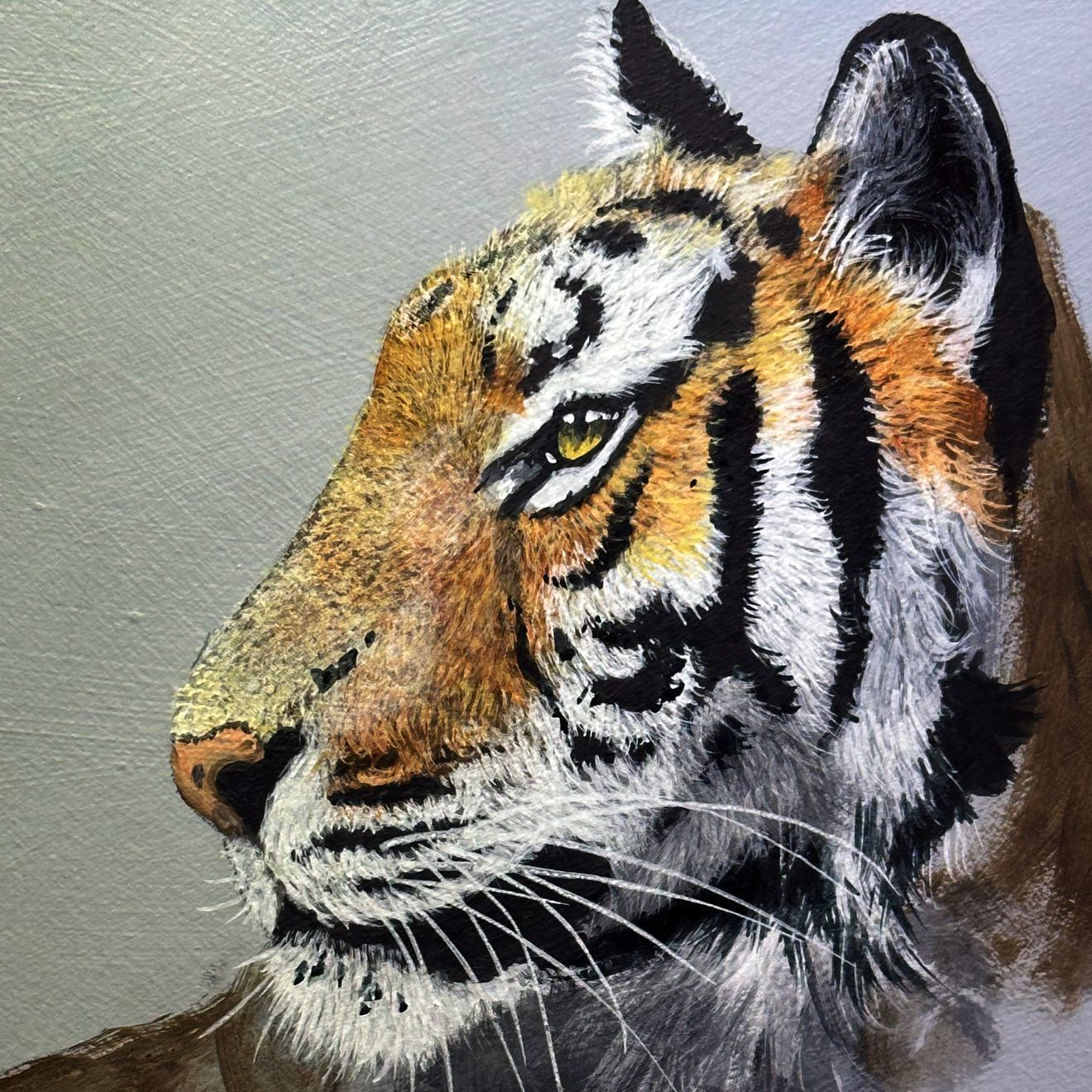 Side-profile painting of a tiger with orange, black, and white fur on a gray background