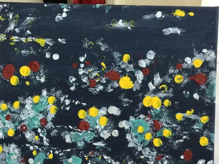 Abstract painting with scattered white, yellow, red, and teal dots on a dark background