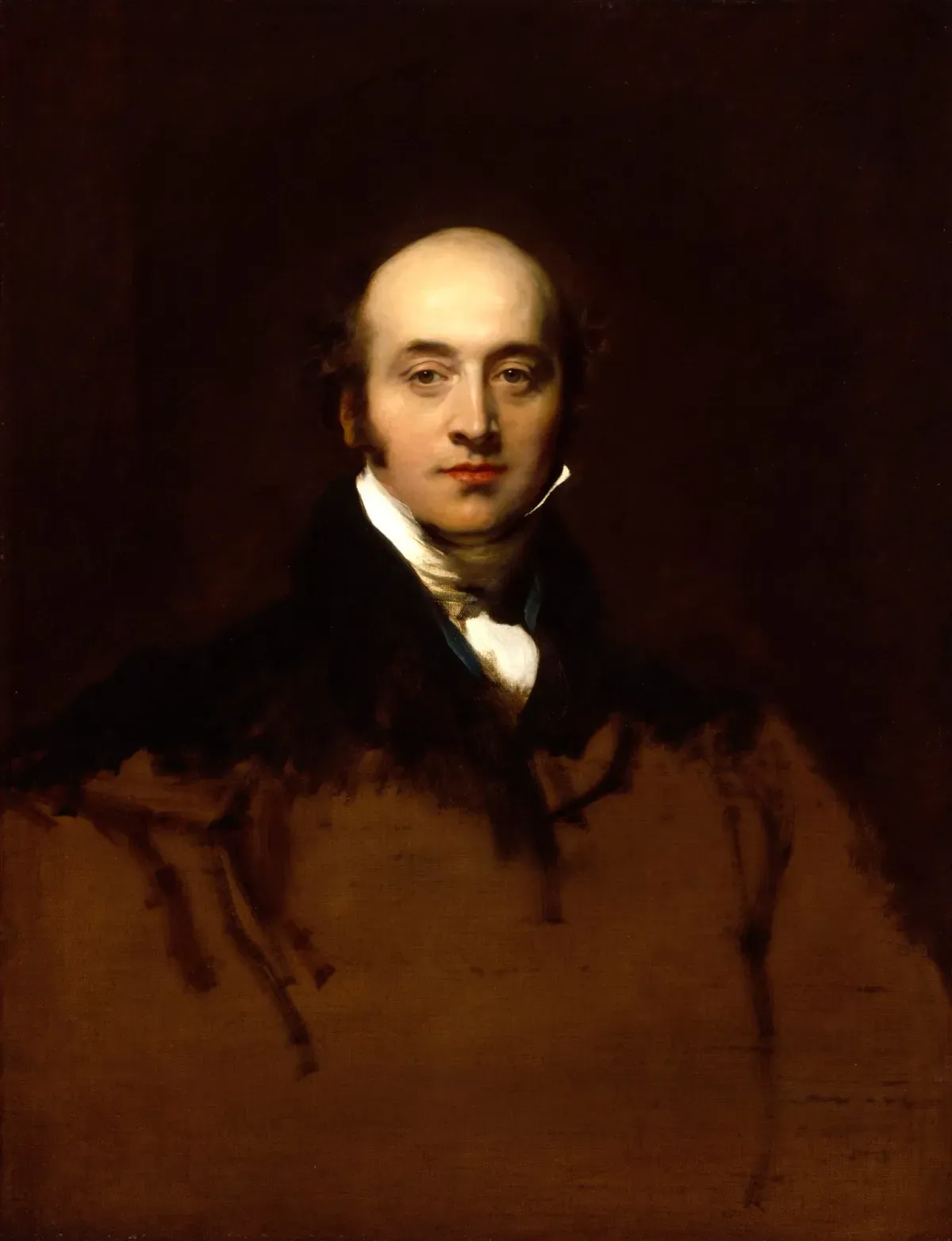 Portrait of a bald man in a dark coat against a plain brown background