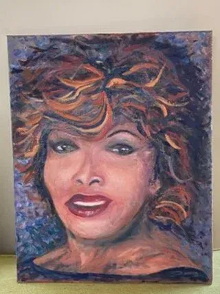 Abstract portrait of a smiling woman with curly hair in blue, purple, and orange tones