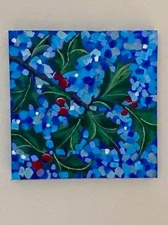 Abstract blue floral painting with red berries and green leaves on a white wall
