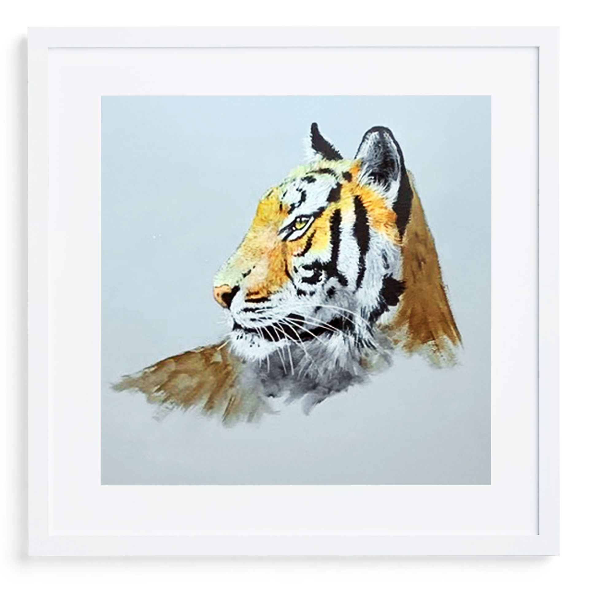 Man standing beside an easel with two tiger paintings in a studio