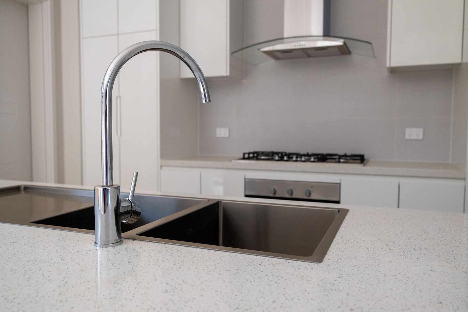 A Person Uses a Yellow and Black Plunger to Clear a Clogged Sink — Dunnerite Plumbing in Mount Peter, QLD