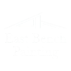 Faint logo with a stylized roofline and barely visible text on a white background